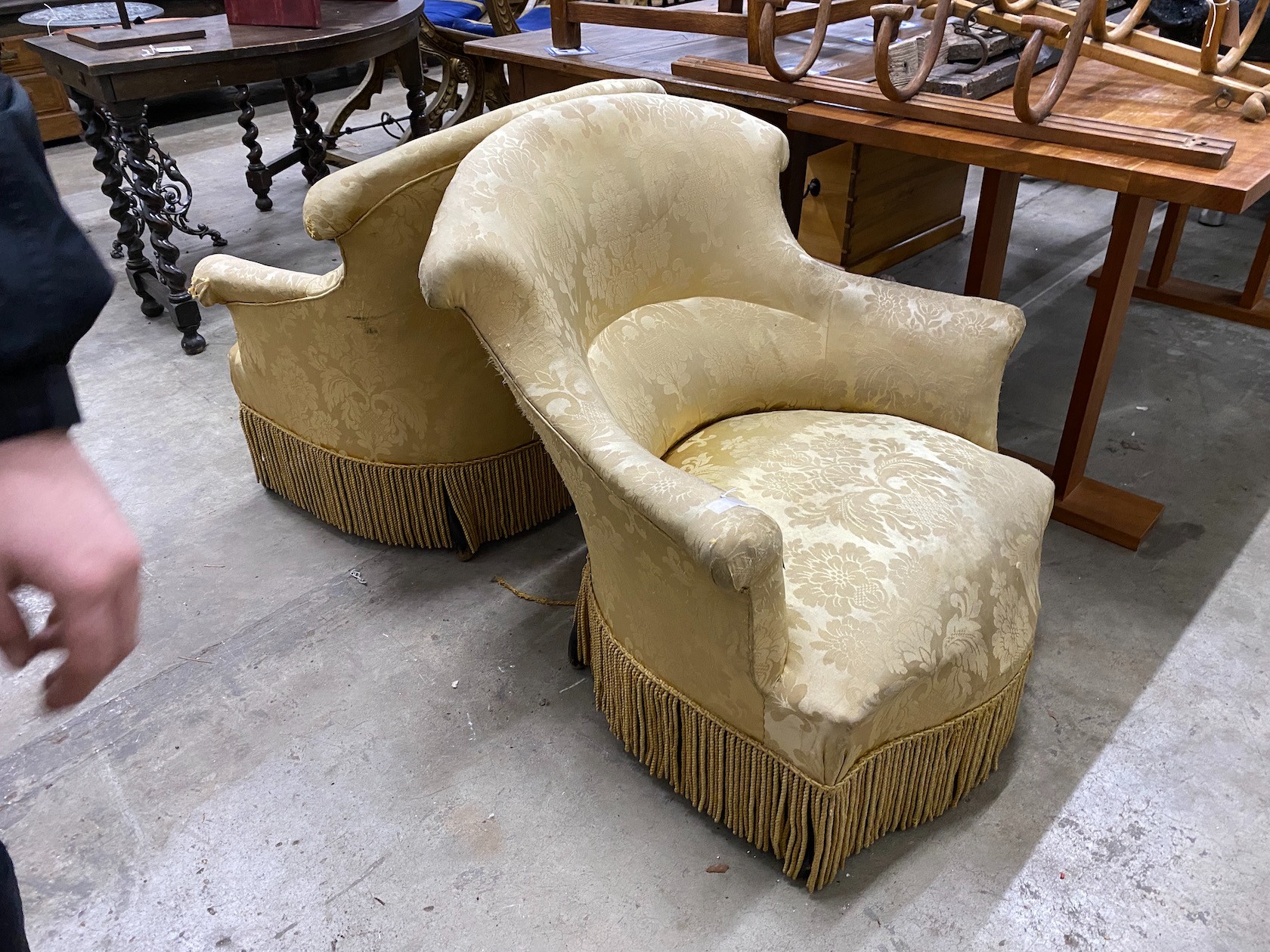 A pair of late Victorian upholstered tub framed armchairs